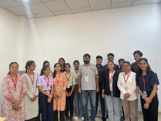 A batch standing together with their trainer at the training centre