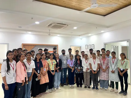 A large batch of students standing together for a group photograph at the centre