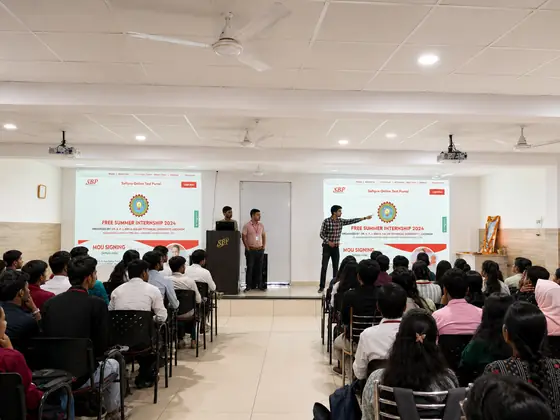 A hall session under Free Summer Internship 2024 and MoU signing banners
