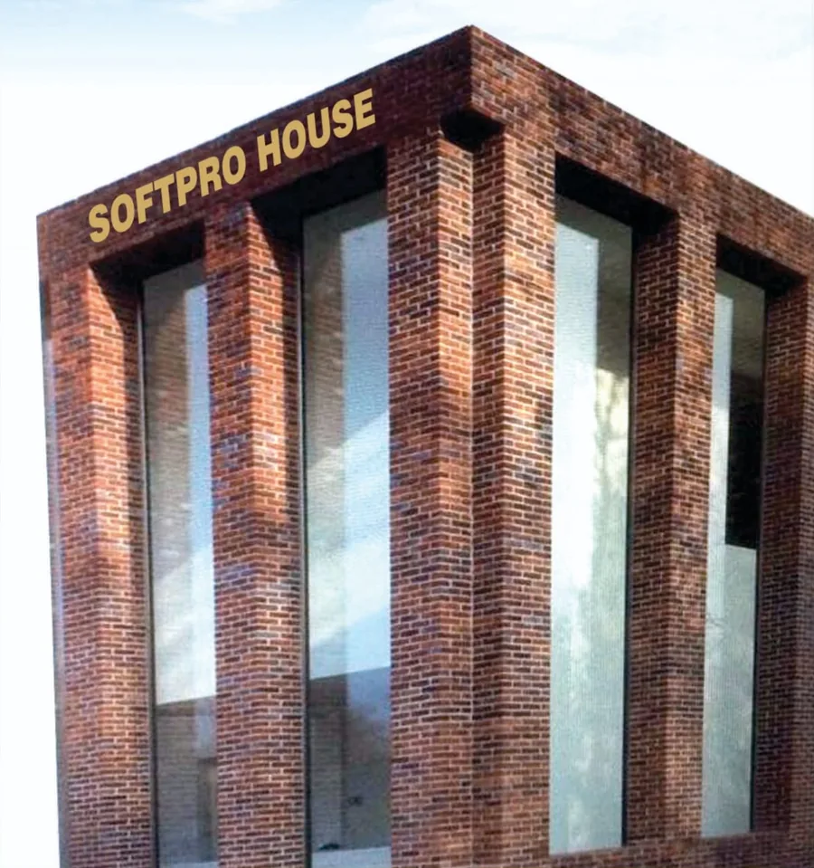 Softpro House — the brick-clad Softpro building in Lucknow, its name lettered along the roofline.